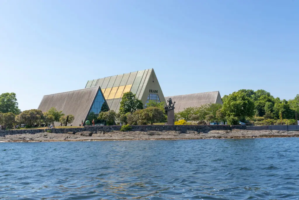 View of the Fram Museum in Oslo, Norway, showing its unique architectural design and location along the waterfront on Bygdoy Peninsula.