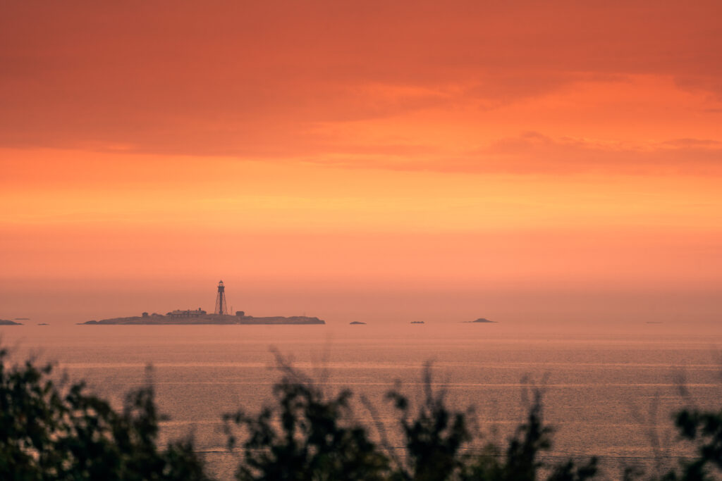 Scenic view of Pater Noster Lighthouse at sunset, Marstrand, Bohuslän, Sweden, captured on a warm summer evening
